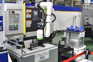 TSUGAMI showcases automation including AGV for inter-process transport. 