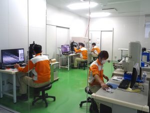 Busy measuring tools and workpieces in the inspection room