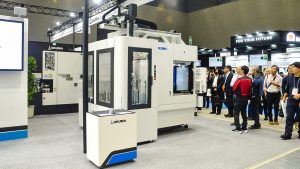 Okuma displayed automation solutions combining a horizontal machining center with a loader and stocker