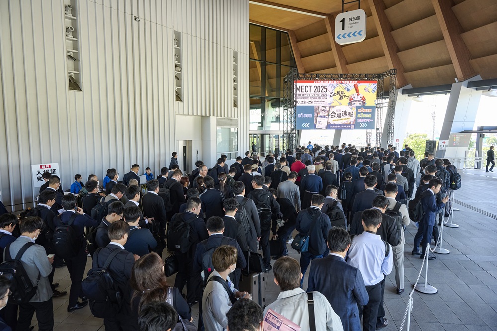 Long lines formed at Hall 1's entrance gate before opening each day