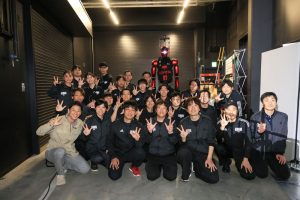 The development team after CUE7's successful debut